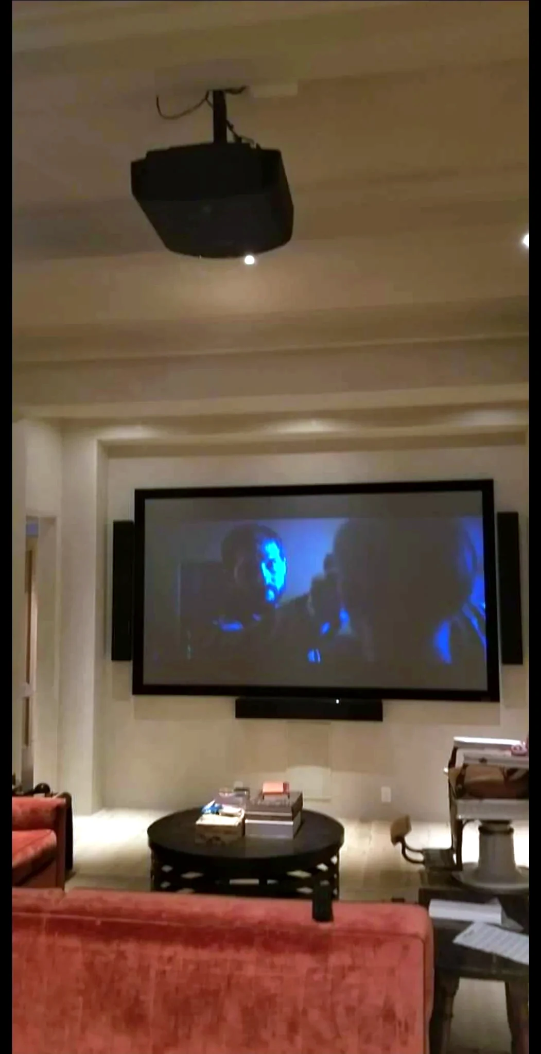Ceiling mounted projector in home theater room