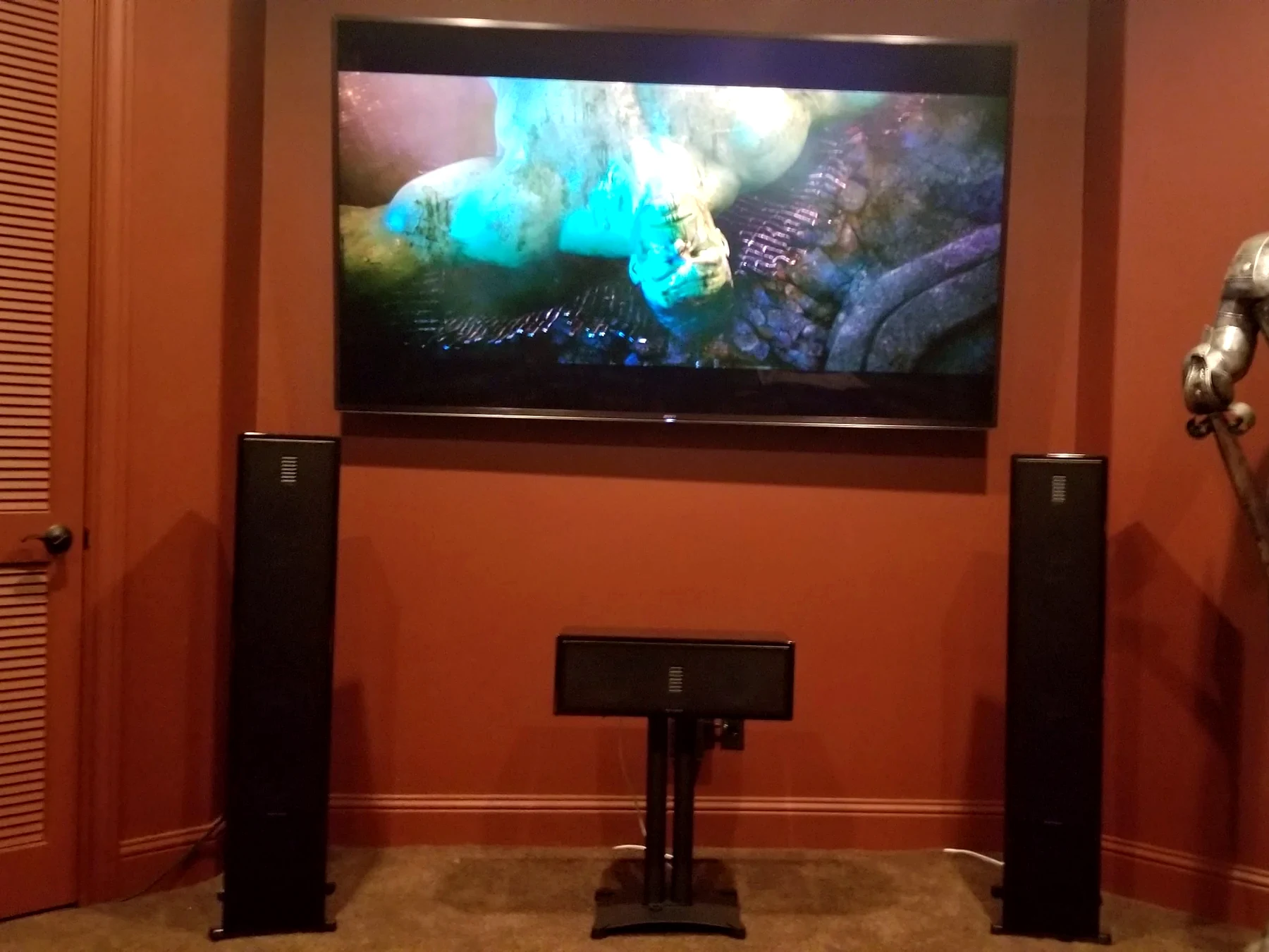 Luxury media room control layout with TV speakers equipment cabinet subwoofer planning and Savant style automation support