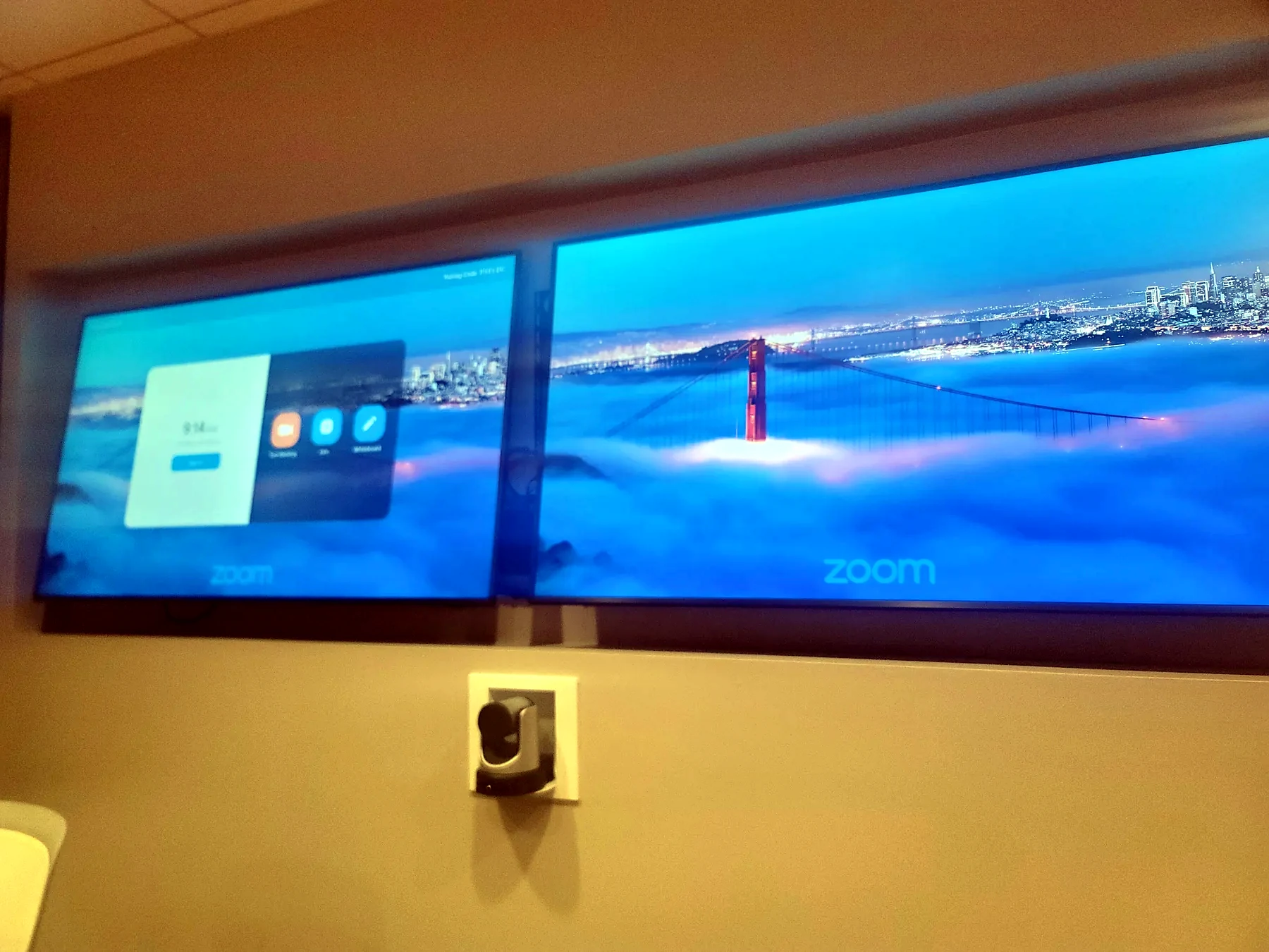Dual display Zoom room with video conferencing camera and commercial display layout